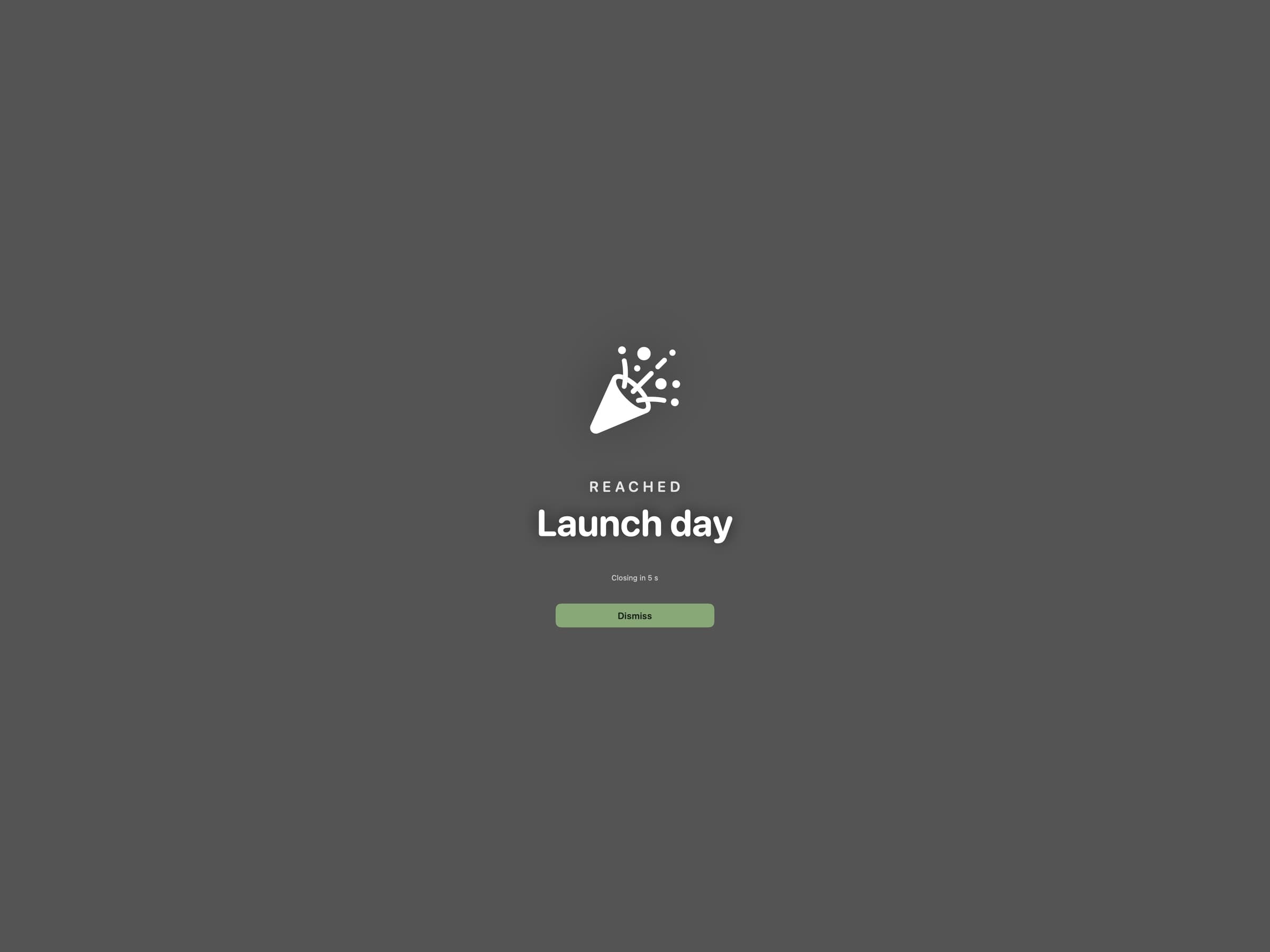 A full-screen Await celebration animation playing on a Mac when a countdown reaches zero
